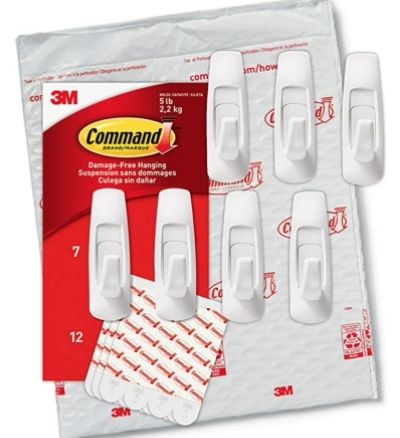 An image of an open packet of large sized Command adhesive hooks. These hooks are a fabulous way to hang your belts.